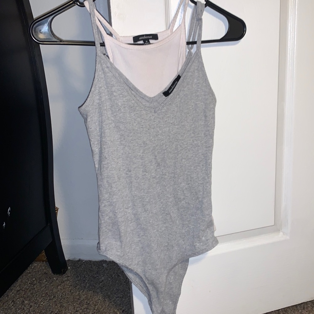 selling both, gray is small and white is medium, soft material bodysuit
